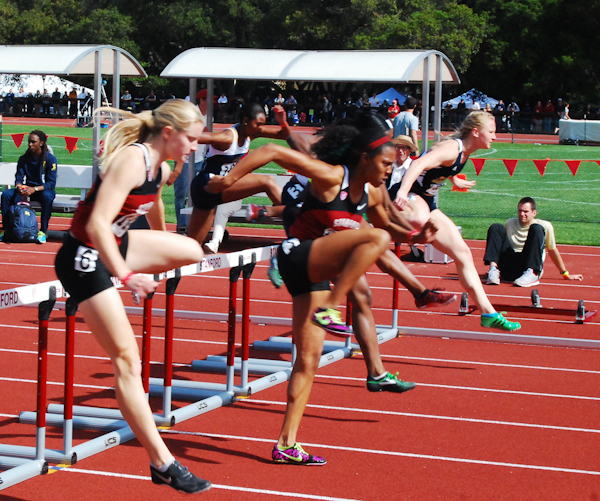 Sophomore Kori Carter, center, had a great Sunday at the Stanford Invitational, winning the 100-meter hurdles with a time of 13.19 and also helping the Cardinal contingent win the 4x100-meter relay. (MADELINE SIDES/The Stanford Daily)
