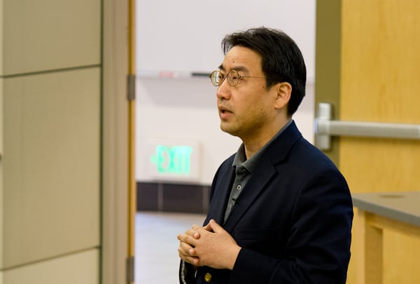 Fu Jun, a professor at Beijing University, addressed a crowd about China's role in a globalizing economy. Fu discussed normalizing China's percent of global GDP against its percent of global population. (ROGER CHEN/The Stanford Daily)