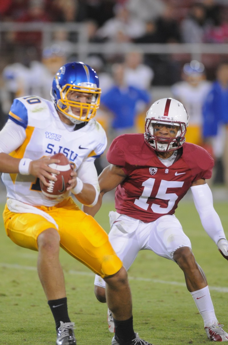 Senior nickle back Usua Amanam sacks San Jose State quarterback David Fales in the Aug. 31 season opener. The Cardinal win marked Amanam's first start and was powered by his fumble recovery and four tackles for loss, including two sacks. (SIMON WARBY/The Stanford Daily)