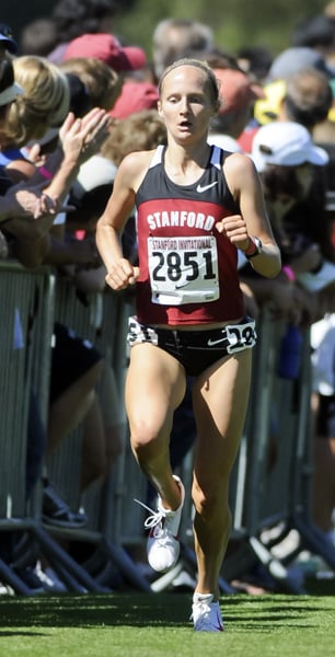 Senior Kathy Kroeger (above) won her third consecutive individual title as the men's and women's cross country teams repeated as team champions at the Stanford Invitational on Saturday. (Stanford Daily File Photo)