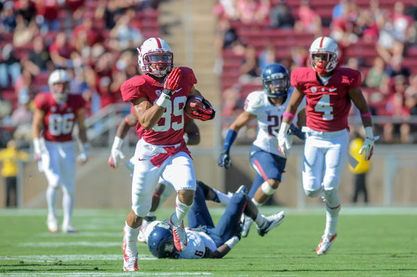 Sophomore Kelsey Young, shown scoring his first career touchdown on a fly sweep against Arizona, transitioned from running back to receiver last offseason. He's perhaps Stanford's fastest player on the field given the recent injury to sophomore receiver Ty Montgomery. (SIMON WARBY/The Stanford Daily)