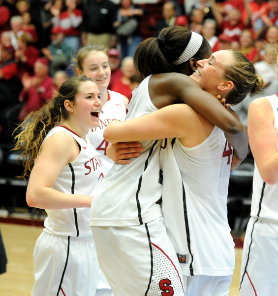 Senior forward Joslyn Tinkle (right) celebrates with junior forward Chiney Ogwumike (left) in her final game on campus. (MICHAEL KHEIR/The Stanford Daily)
