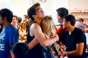 Students embrace after the 2013 ASSU election results were released April 31. (The Stanford Daily/IAN GARCIA-DOTY). 