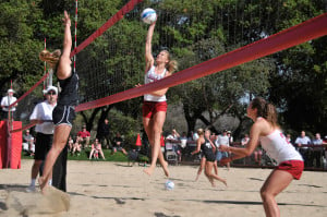 The No. 1 pairing of junior Carly Wopat (center) and freshman Jordan Burgess (right) won Stanford's first ever sand volleyball game 2-0 at the ACSR Sand Volleyball Courts on Tuesday. (ZETONG LI/The Stanford Daily)
