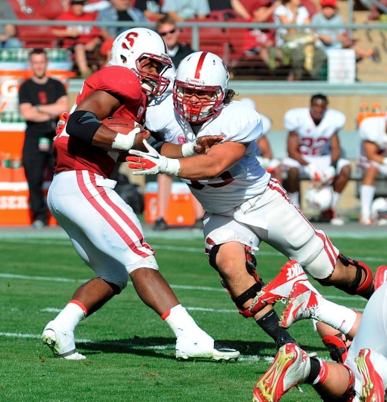 Sophomore running back Barry Sanders (left)