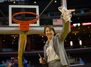 Tara VanDerveer cuts down the nets after Stanford captured the 2012 Pac-12 title.  (DON FERIA/StanfordPhoto.com)