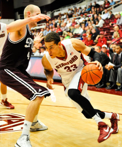 Senior forward Dwight Powell (right), coming off an electric season in which he led the Cardinal in scoring with 14.9 points per game, will look to lead his class to its first NCAA Tournament berth this season. That quest begins tonight at Maples Pavilion against Bucknell, which made the Big Dance last season. (ZETONG LI/The Stanford Daily)