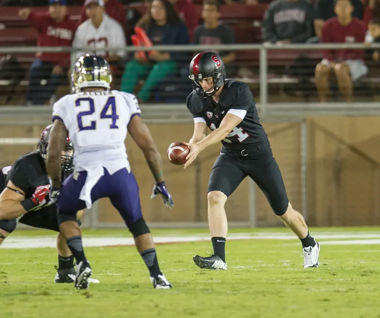 Ben Rhyne (14) had a career-long 58-yard punt against Washington earlier this season. (David Bernal/isiphotos.com )