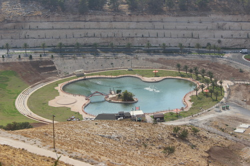 Decorative pool with lush greenery for illegal Israeli settlers in the West Bank.