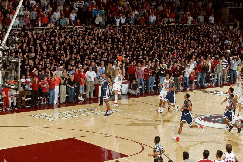 when Nick Robinson ’04 M.A. ’05 sunk a 35-foot runner as time expired to give No. 2 Stanford an 80-77 win against No. 12 Arizona — sending Musburger and Vitale into hysterics, the Sixth Man Club onto the Maples Pavilion hardwood and the Cardinal to a 20-0 record — there were, in truth, no words to describe what had just happened. Ten years to the day after Robinson’s iconic shot, that has changed. (DAVID GONZALES/Stanford Athletics)