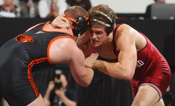 Senior Dan Scherer (right) notched an upset in his first-round bout with No. 16 seed Alex Polizzi at the NCAA Championships, but was forced to withdraw from the tournament afterwards due to injury. (DAVID ELKINSON/isiphoto.com)
