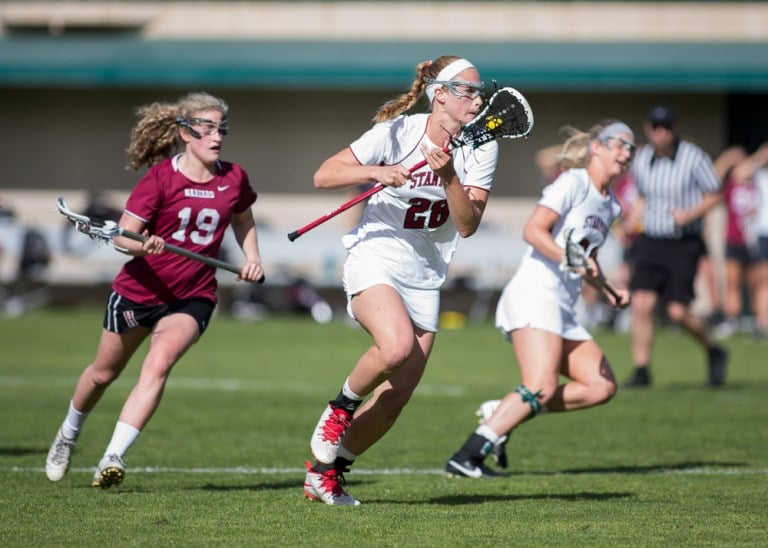 Freshman Alex Poplawski (center) scored four goals over the weekend to increase her season total to 23. (SHIRLEY PEFLEY/isiphotos.com)