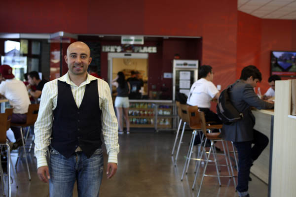 Ike Shehadeh, proprietor of Ike's Place, pictured in 2012 prior to the restaurant's closure in Spring 2014. (KEVIN TSUKII/The Stanford Daily)