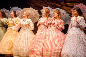 Michele Schroeder (in cream with blue bow) as Edith (double cast with Ellen Leslie) with some of her sisters, The Pirates of Penzance.  Photo by Charles Martin, 2014.