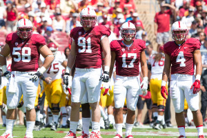 Fifth-year seniors Henry Anderson (91), A.J. Tarpley and David Parry (58) and junior Blake Martinez (4) must prepare for a unique Army rushing attack. (TRI NGUYEN/The Stanford Daily)