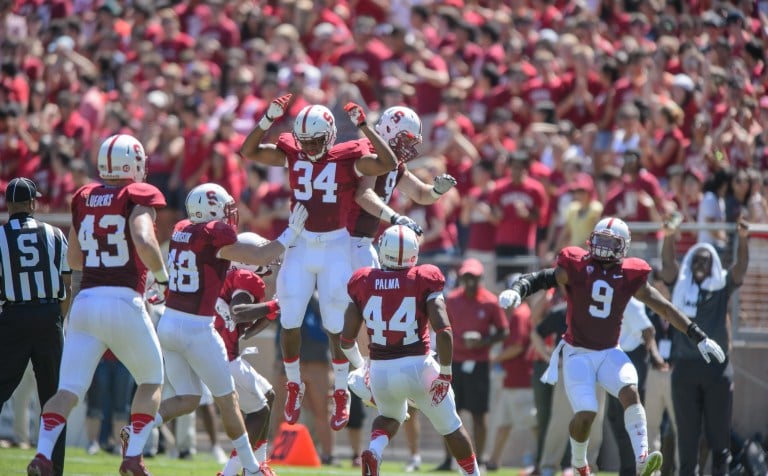 Sophomore outside linebacker Peter Kalambayi (34) and the Stanford defense were the heroes in Seattle, allowing only one offensive touchdown and sacking Washington quarterback Cyler Miles four times. (JOHN TODD/isiphotos.com)