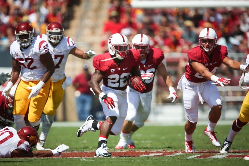 Senior tailback Remound Wright (22) gained 60 yards on 11 carries, but a bad handoff exchange between him and senior quarterback Kevin Hogan resulted in a costly turnover in Trojans territory, one of the many miscues the Cardinal offense had on Saturday.