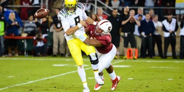 In last year's 26-20 victory over the Ducks, Stanford's defenders were able to get after an injured Marcus Mariota (left), who will likely be operating at 100 percent for Saturday's game and able to better show off and utilize his mobility. (SIMON WARBY/The Stanford Daily)