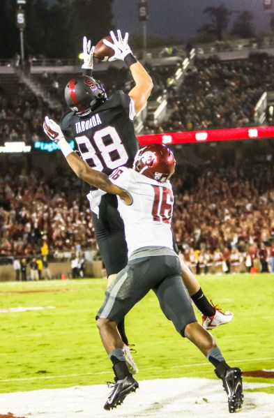 Sophomore tight end Greg Taboada (left) reels in his first career touchdown in the second quarter of Friday night's game. He finished the game with two red-zone touchdowns to spark an offense that has struggled in that regard. (ROGER CHEN/The Stanford Daily)