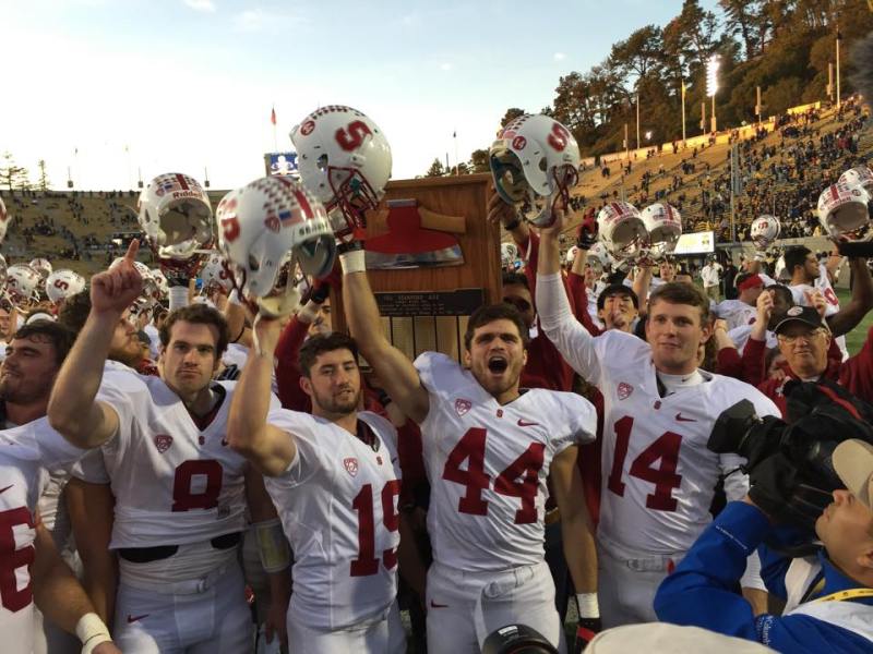 Seniors Kevin Hogan, Jordan Williamson, John Flacco and Ben Rhyne (left to right) celebrate after they routed Cal 38-17 on the road to secure the Axe for a fifth straight year. (ZETONG LI/The Stanford Daily)