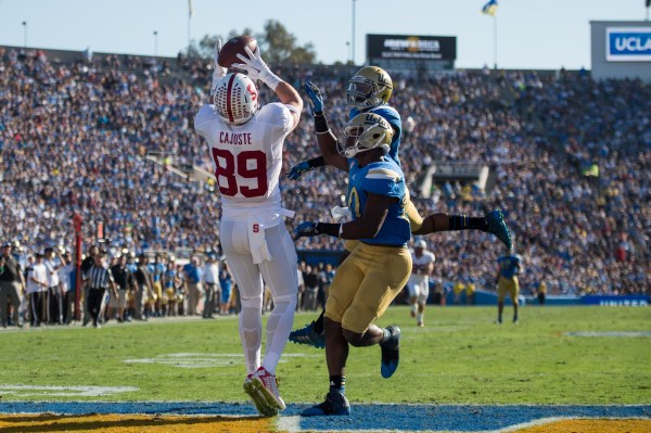 Senior wide receiver Devon Cajuste (left) beats two UCLA defenders to catch Hogan's second touchdown pass of the afternoon, a 37-yard bomb that put Stanford up by two scores by the half. (KAREN AMBROSE HICKEY/stanfordphoto.com)