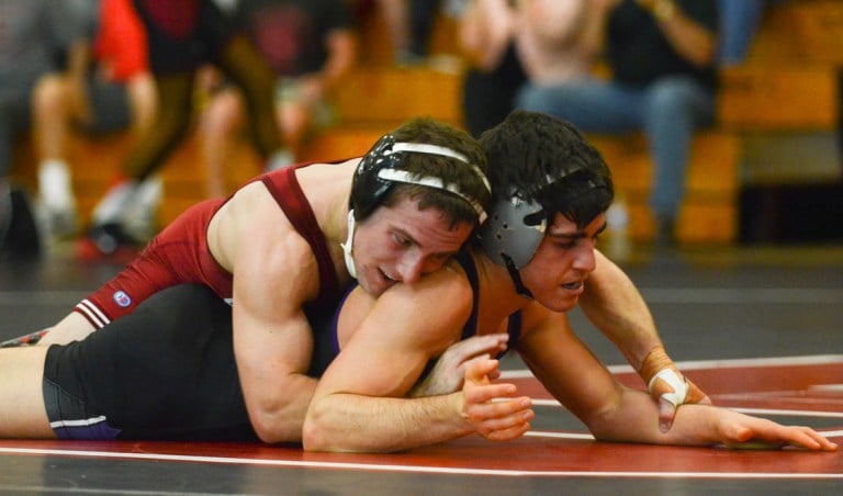 Senior Evan Silver (left) made his season debut on Saturday against Northwestern and notched a major decision over Garrison White. (RAHIM ULLAH/The Stanford Daily)