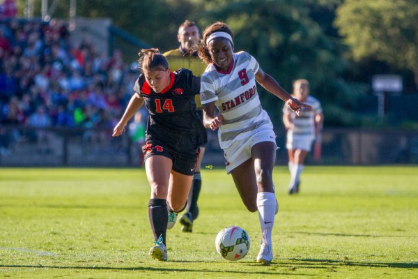 Senior forward Chioma Ubogagu (right) notched a second-half hat trick as the top-seeded Cardinal roared back from an early 2-0 deficit to roll over Cal State Fullerton by a score of 5-2.  (ROGER CHEN/The Stanford Daily)