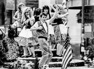 Ferris Bueller (Matthew Broderick) crashes a local parade and regales the crowd with his lip-synched rendition of "Danke Schoen" in "Ferris Bueller's Day Off." Courtesy Paramount Pictures.
