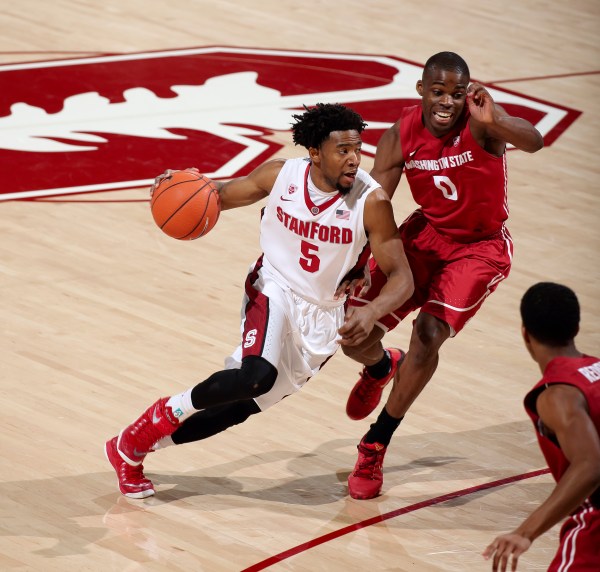 Senior guard Chasson Randle (left) pushed across 24 points in the Cardinal's victory over No. 21 Washington, including two clutch shots to tie the game in regulation and force an overtime. (HECTOR GARCIA-MOLINA/stanfordphoto.com)