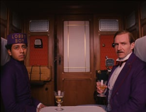 Tony Revolori as “Zero” and Ralph Fiennes as “M. Gustave” in THE GRAND BUDAPEST HOTEL. courtesy of fox searchlight pictures