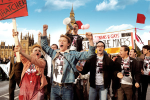 (Front row, left to right) Faye Marsay as Steph, George Mackay as Joe, Joseph Gilgun as Mike, Paddy Considine as Dai and (second row, with megaphone) Ben Schnetzer as Mark in PRIDE to be released by CBS Films.