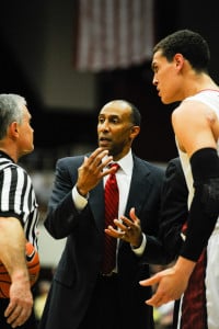 Men's basketball head coach Johnny Dawkins (center) will need to push his team hard down the stretch in order to qualify for the NCAA tournament. (Stanford Daily file photo)