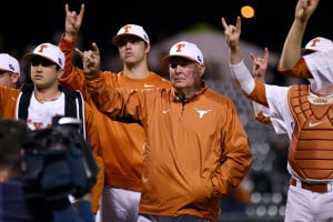 Texas's Augie Garrido (center) has amassed 1,928 victories over his 47 years as a head coach, the most in college baseball history. He has also won five national championships. (JONATHAN GARZA/The Daily Texan)