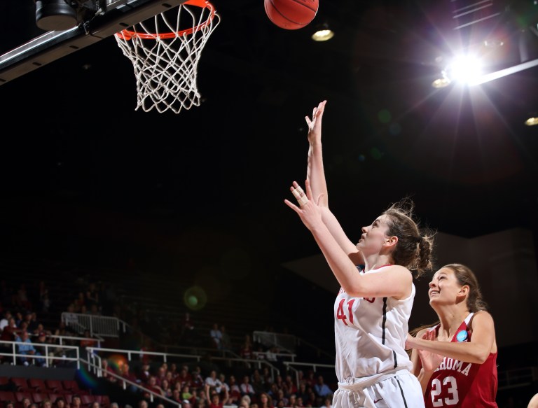 (BOB DREBIN / isiphotos.com) Senior forward Bonnie Samuelson (left) led the Cardinal with 17 points against the Notre Dame Fighting Irish. She went 5-of-8 from three points range to end her career on the Farm.