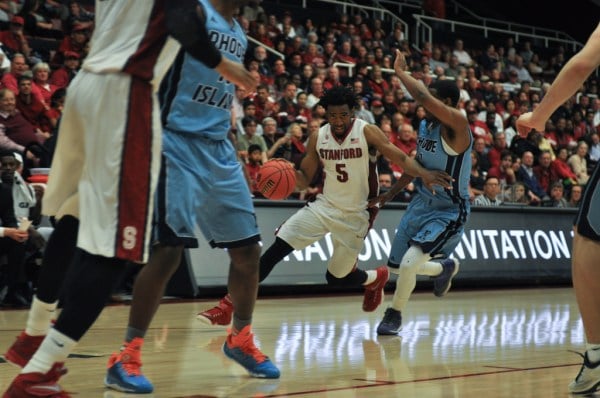 Senior guard Chasson Randle (center) dropped a career-high 35 points on Rhode Island to move within 26 points of the all-time Stanford scoring record in Stanford's victory over Rhode Island in the second round of the NIT. (RAHIM ULLAH/The Stanford Daily)