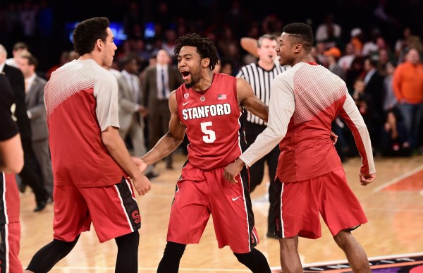 Senior guard Chasson Randle (center) scored 25 points in the swan song of his Cardinal career as Stanford overcame a Miami rally to win 66-64 in overtime to clinch the third NIT championship in program history. (BOB SOLOMON/Stanford Athletics)
