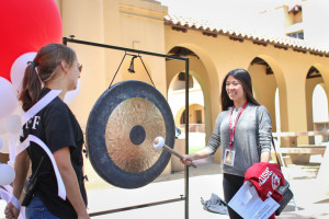 The tradition of banging the gong after officially committing to Stanford was alive and  well Friday at the activities fair. (ANDREA LIM/The Stanford Daily)