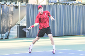 Senior John Morrissey's three-set win over USC's No. 19 Roberto Quiroz clinched Stanford's 4-3 upset victory over the No. 5 Trojans on Saturday. (RAHIM ULLAH/The Stanford Daily)