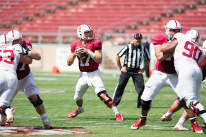 Junior quarterback Ryan Burns (center) had some issues with his accuracy and didn't ever look comfortable in the pocket on Saturday. (FRANK CHEN/The Stanford Daily)