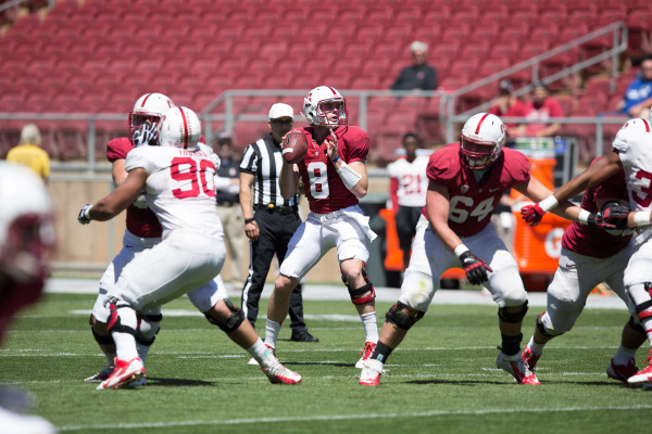 Fifth-year senior quarterback Kevin Hogan (center) showed why there isn't going to be any quarterback controversy at the start of the 2015 season, as he was clearly the best of the three on the field at the Spring Game. (FRANK CHEN/The Stanford Daily)