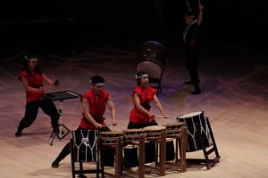 Students strike traditional Japanese drums in full costume. (CATALINA RAMIREZ-SAENZ/The Stanford Daily)