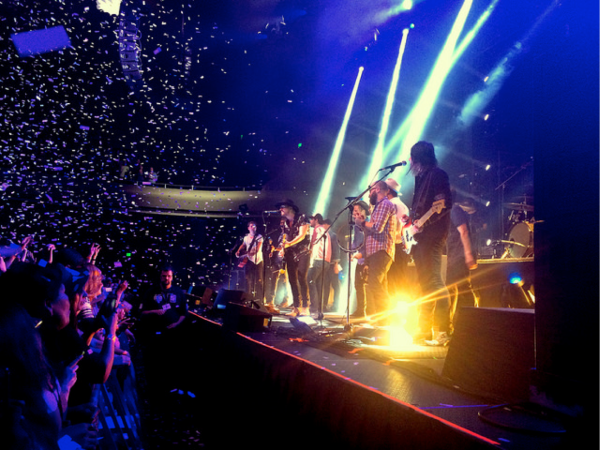 Switchfoot performs on-stage alongside Need2Breathe. (ALINA ABIDI, The Stanford Daily)