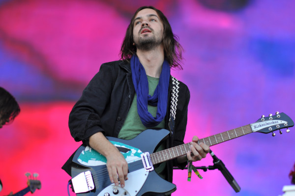 Kevin Parker supported by the psychedelic background. RAHIM ULLAH/The Stanford Daily