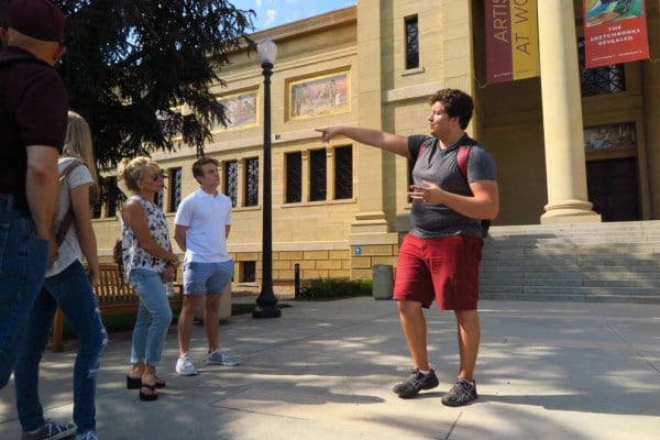 Tour guide Kyle Efken '17 introduces visitors to the Cantor Arts Center. (NINA ZUBRILINA/The Stanford Daily)