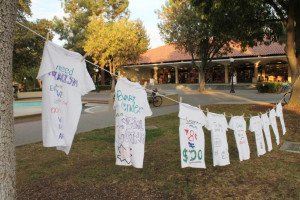The Stanford Women's Coalition has partnered with The Clothesline Project for the second year in a row to bring attention to the issue of sexual assault on campus. Decorating and hanging t-shirts proves a way for victims to express their emotions and for students to open  dialogue about assault. The Women's Coalition aimed to make the project more inclusive this year by incorporating conversation about gender and gender equality in society. (CATALAN RAMIREZ-SAENZ/The Stanford Daily)