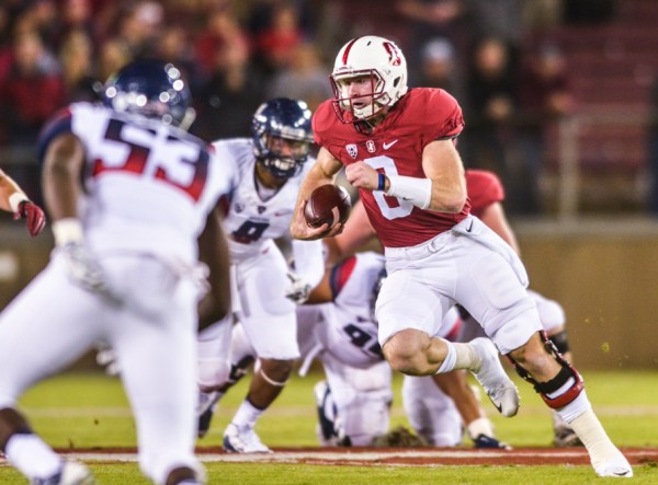 Fifth-year senior Kevin Hogan (center right) produced another sterling performance in Saturday night's win over Arizona, completing 89.5 percent of his passes and throwing 2 touchdowns in the Cardinal's 55-17 rout of Arizona. (SAM GIRVIN/ The Stanford Daily)