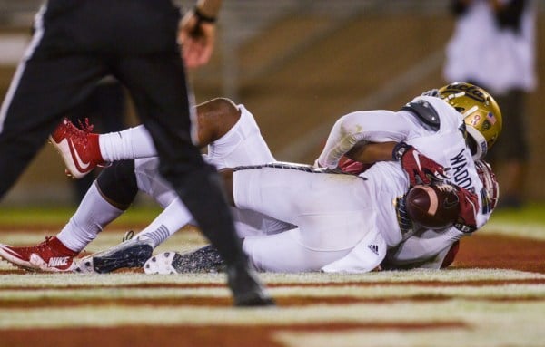 In a catch that trended nationally on Twitter and drew the eyes of the country to The Farm, junior Francis Owusu (back) stretched Stanford's lead to 42-17 as the No. 15 Cardinal trounced the No. 18 Bruins by a score of 56-35. (SAM GIRVIN/The Stanford Daily)