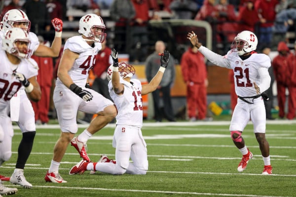 Fifth-year senior wide receiver Rollins Stallworth (center) rejoices as Washington State kicker Erik Powell misses wide right on the potential game-winning 43-yard field goal as time expires. Powell had been a perfect 5-of-5 in the game before his crucial miss. If made, the kick would have propelled Washington State into first place in the Pac-12 North; instead, Stanford now has an effective stranglehold on the division title. (BOB DREBIN/isiphotos.com)