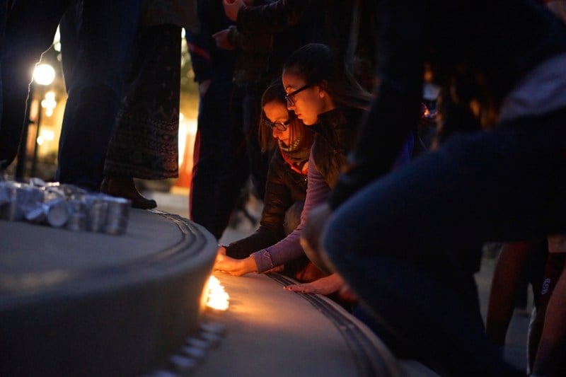 Participants set their candles in a single line along the White Plaza steps.