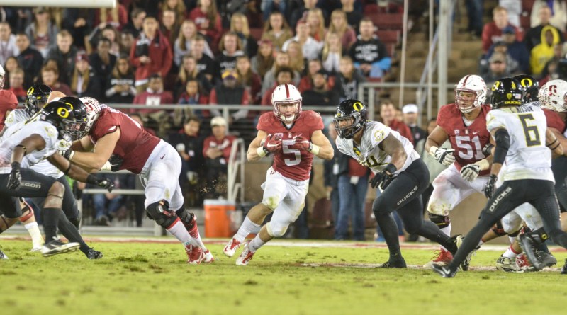 Although Christian McCaffrey (center) added 244 all-purpose yards to become Stanford's all-time leader in single-season all-purpose yards and passed Toby Gerhart for the program record with his eighth straight 100-yard rushing game, Stanford still fell in a heartbreaker to the Ducks, 38-36. (SAM GIRVIN/The Stanford Daily)